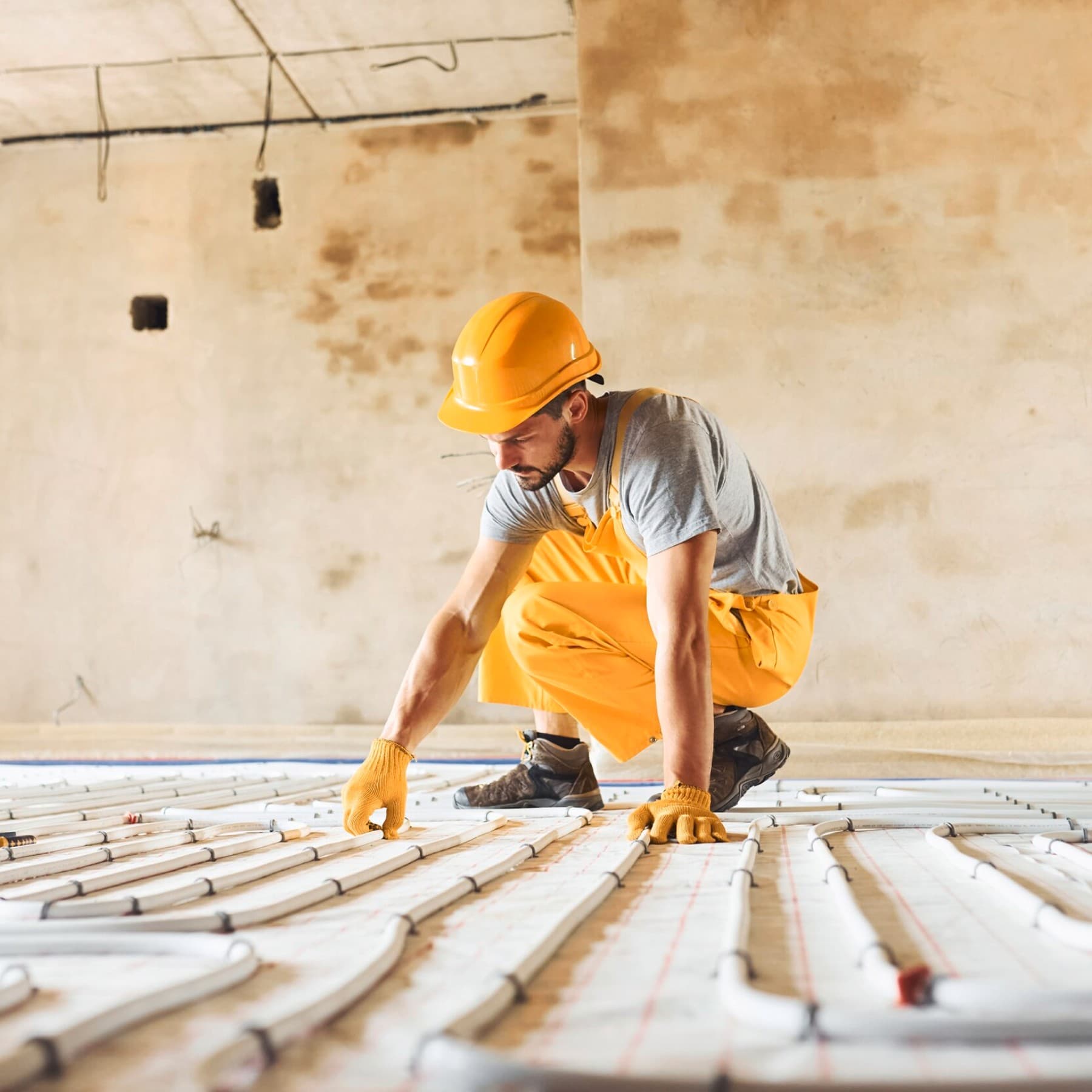 Man laying underfloor heating