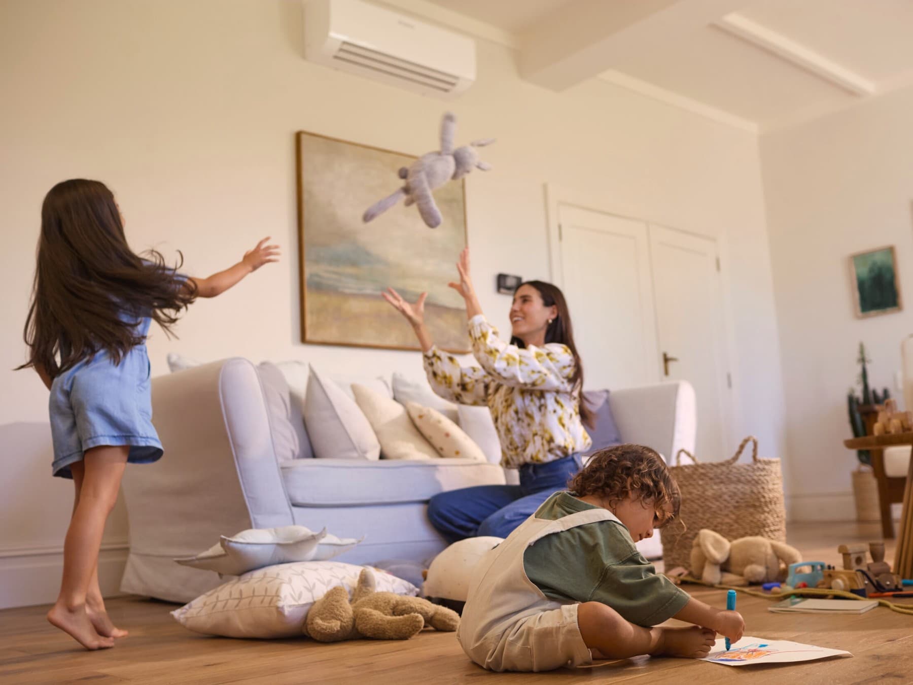 Family playing comfortably in living room.