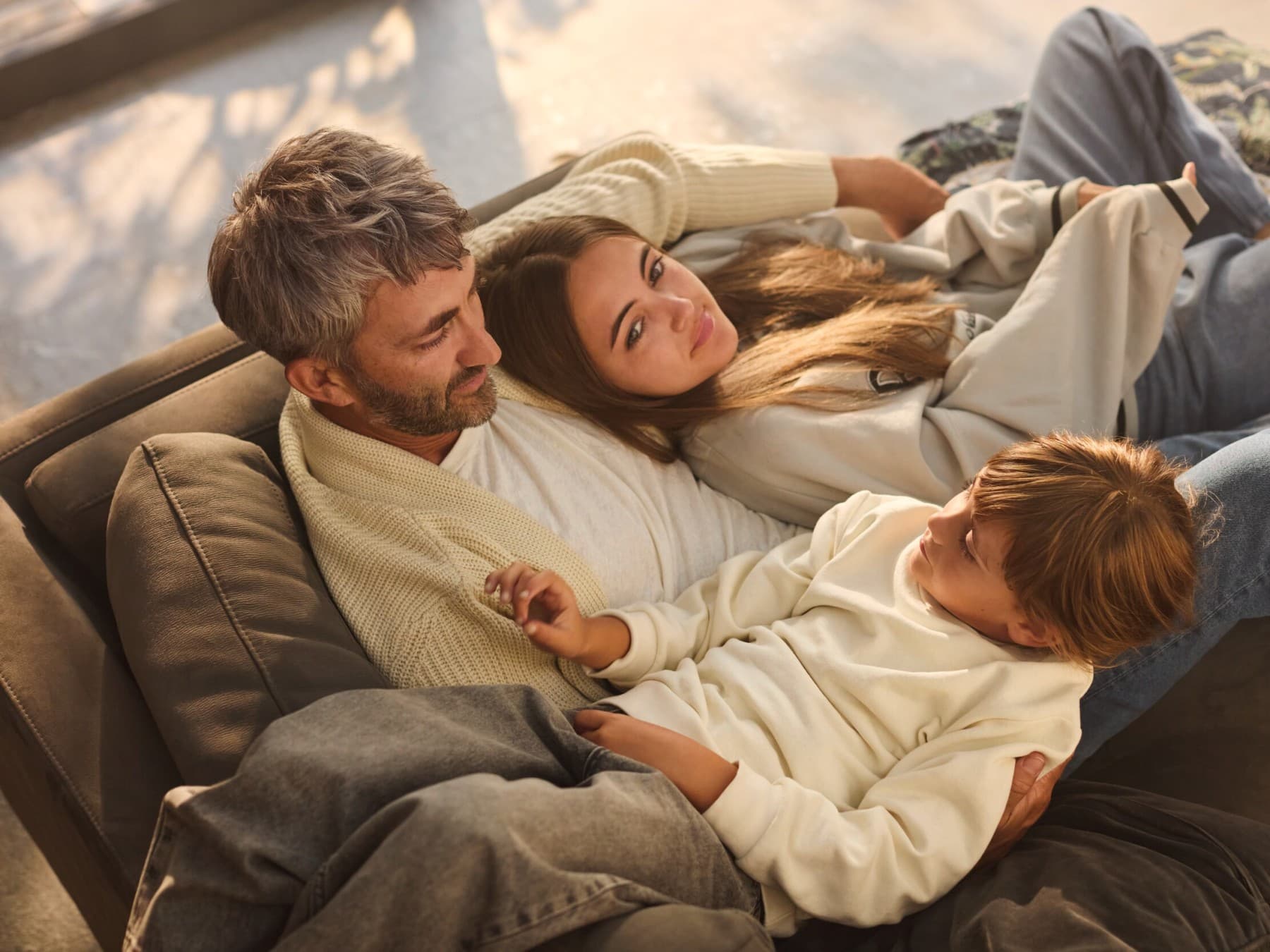 Family enjoying time together on the sofa