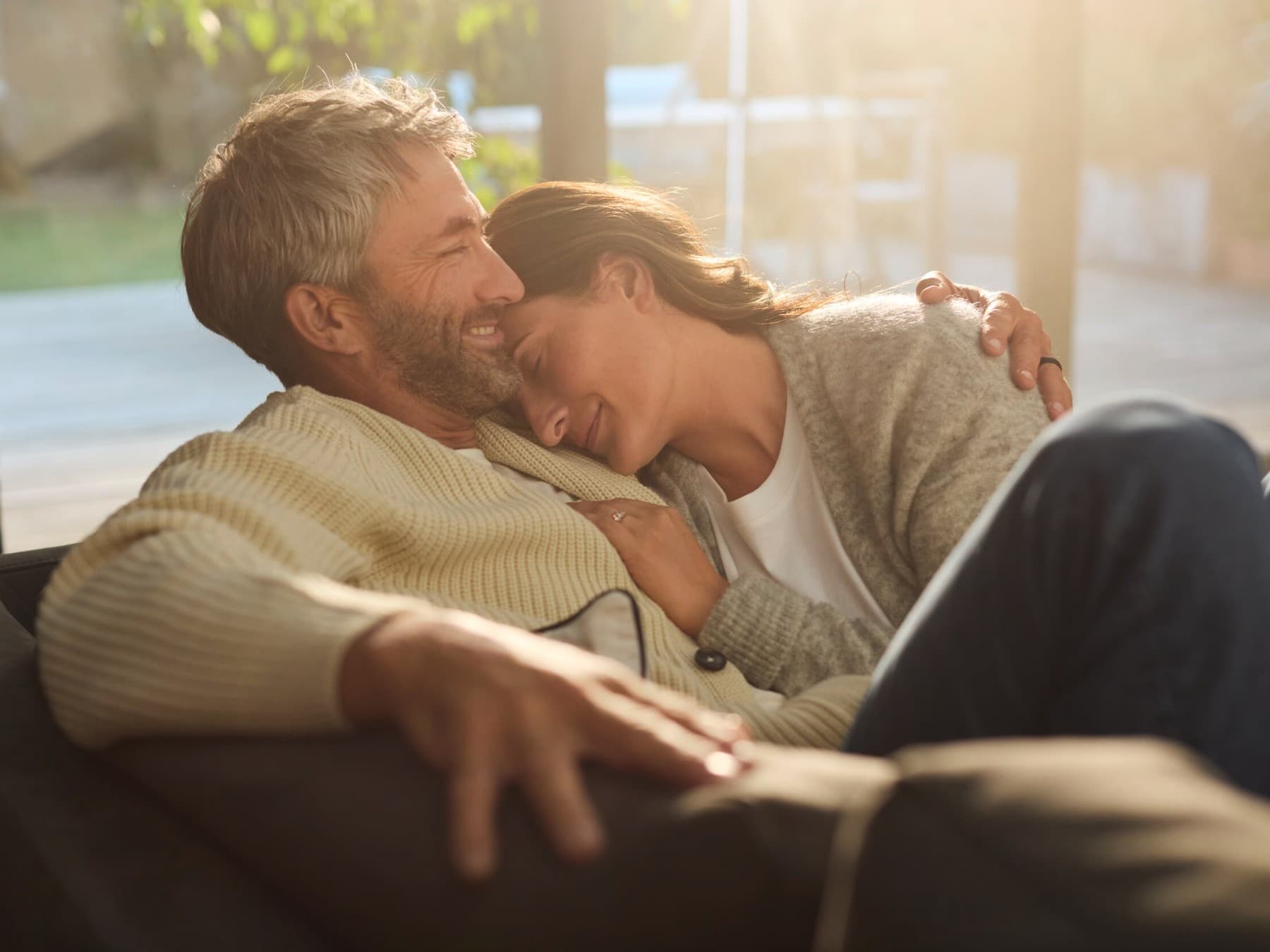 Couple relaxing together on a sofa
