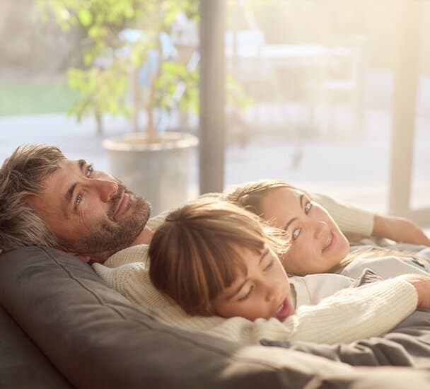 Family relaxing on couch