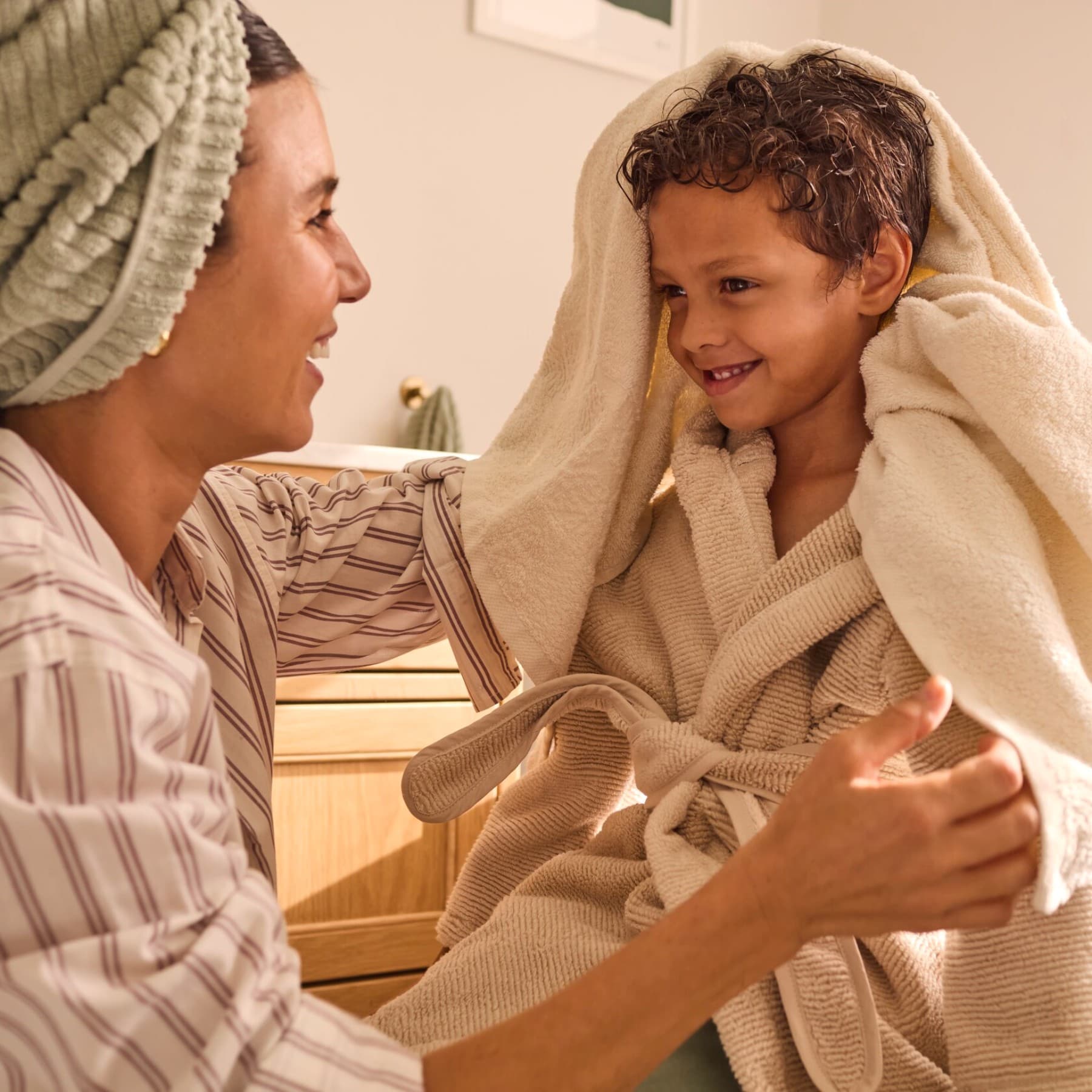 Kid and mother in bathroom