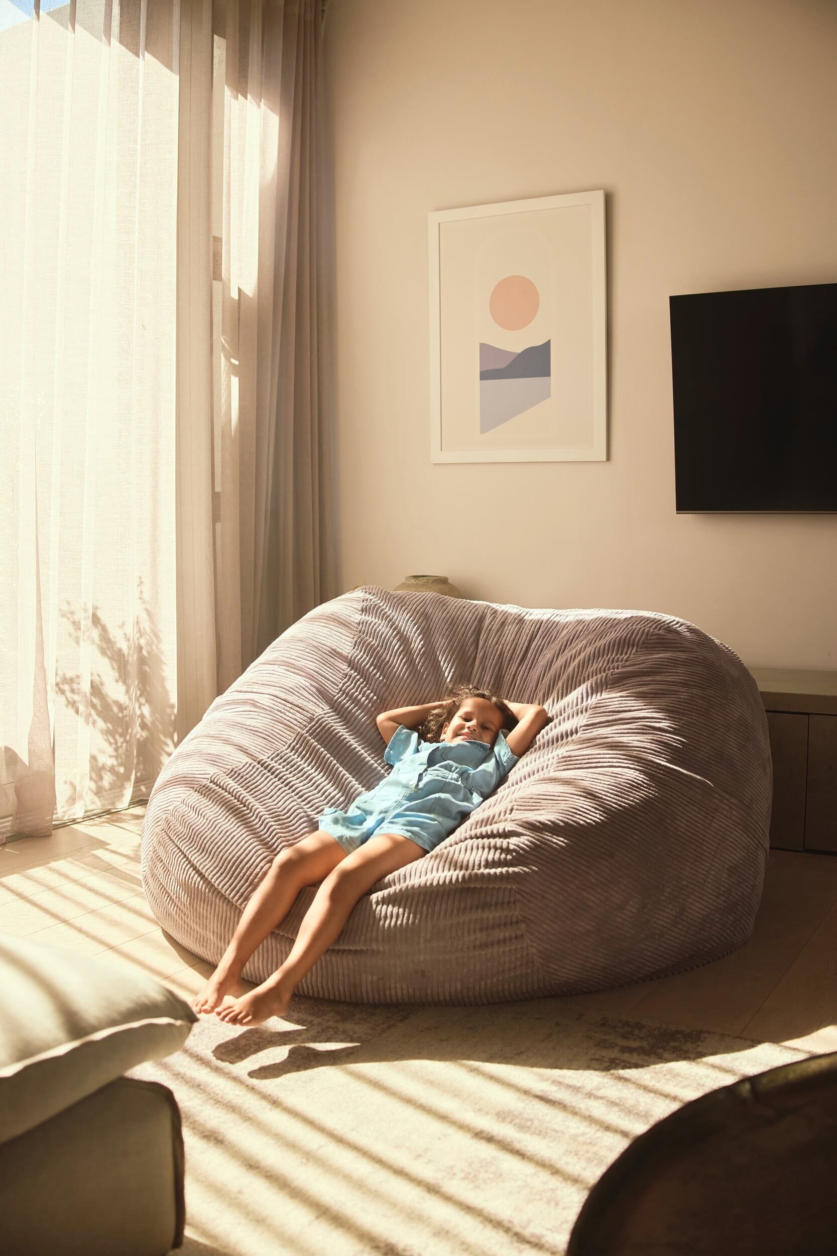 Girl is relaxing in a beanbag