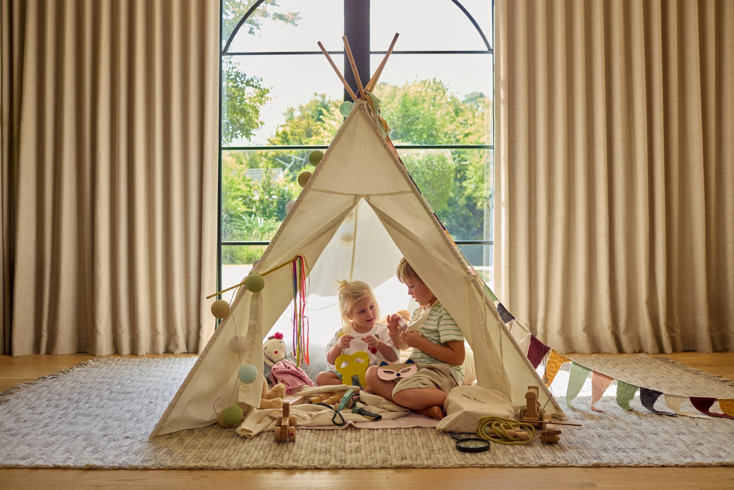 Children playing in a tent