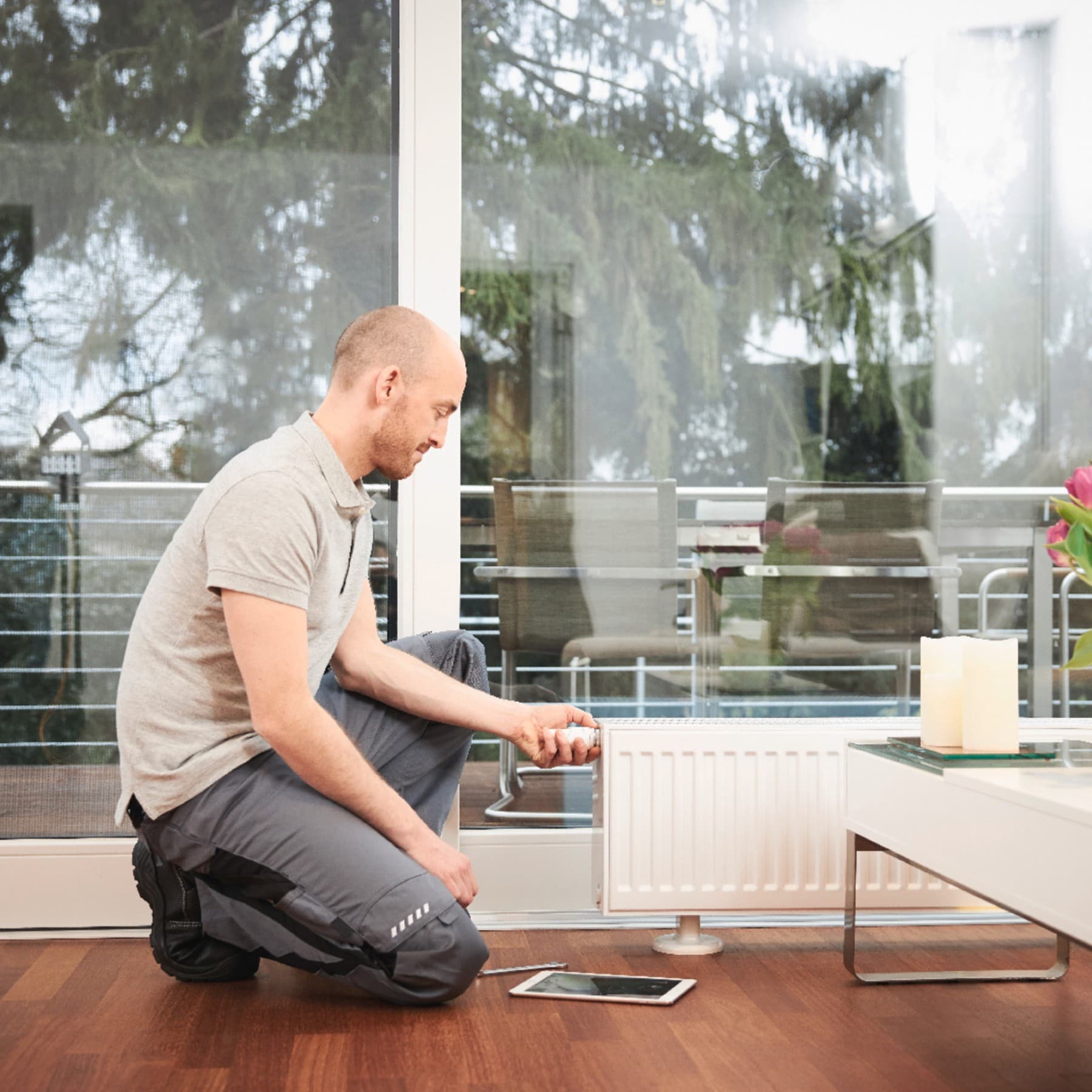 A man working on a radiator