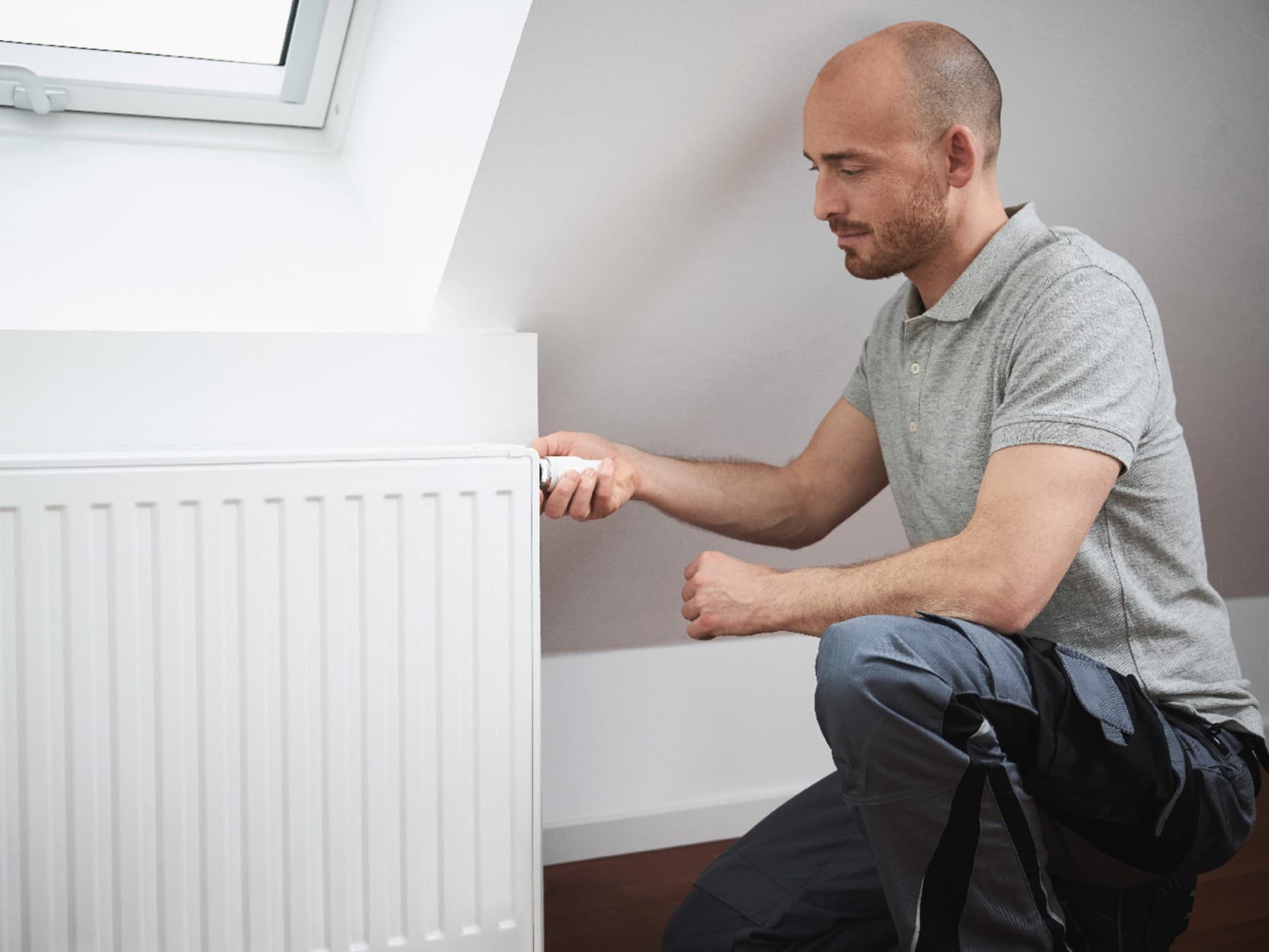 Man turns radiator on