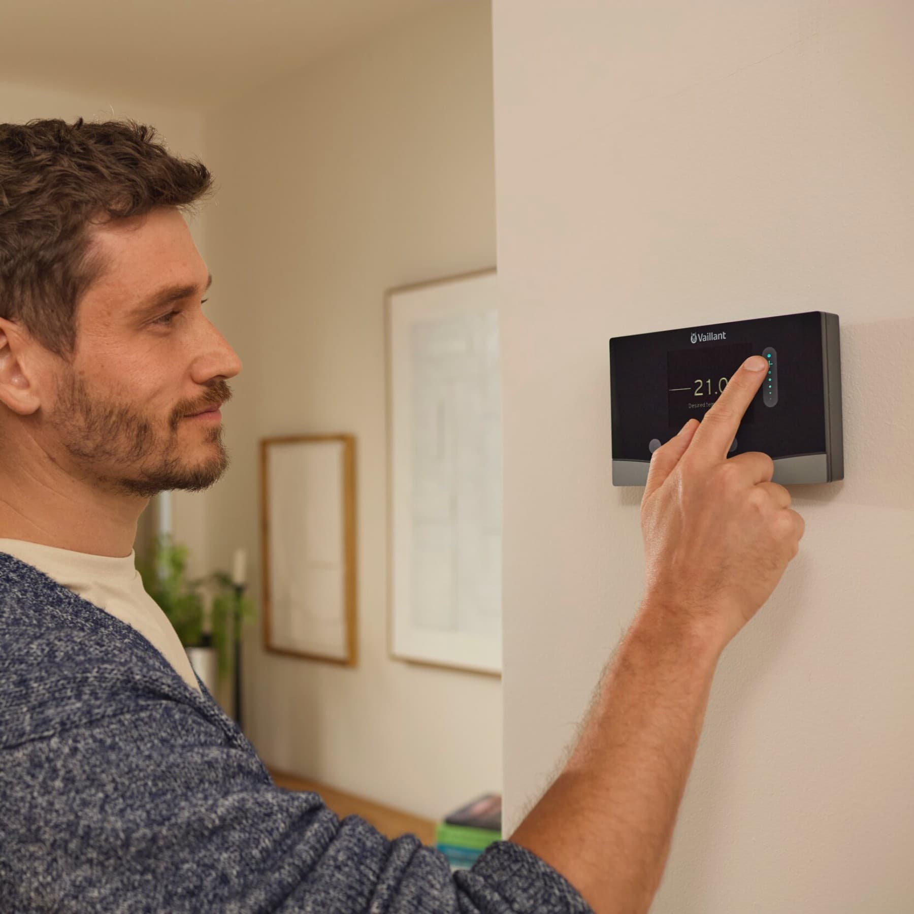 Man setting heating control