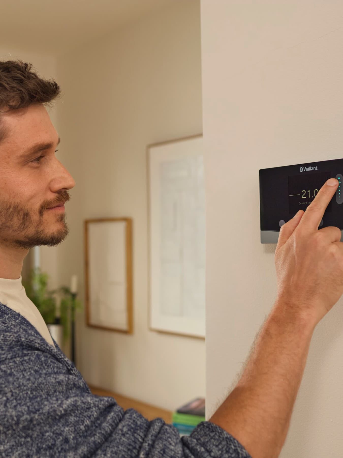 Man setting heating control