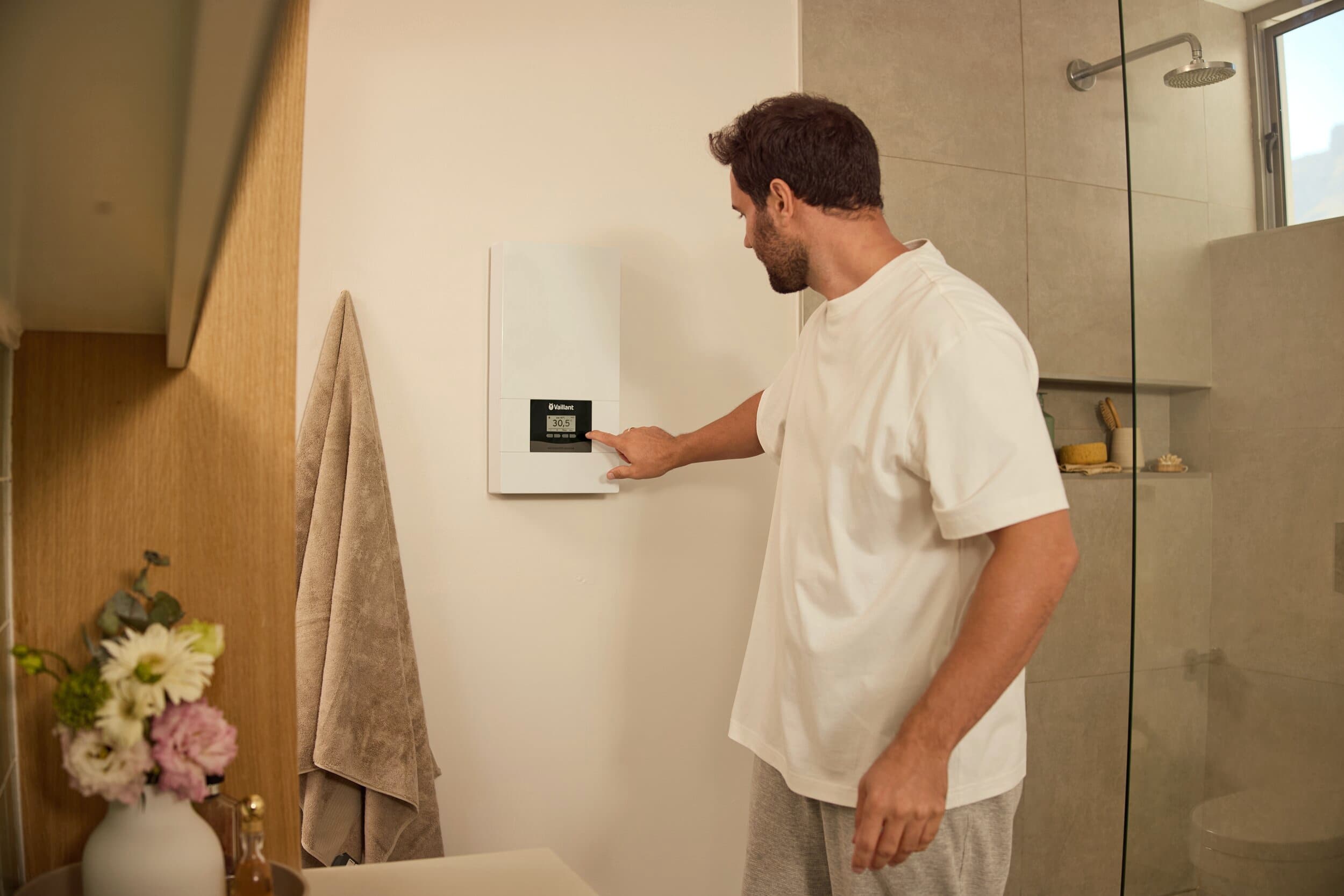 A man is adjusting the temperatrue on the electronicVED exclusive
