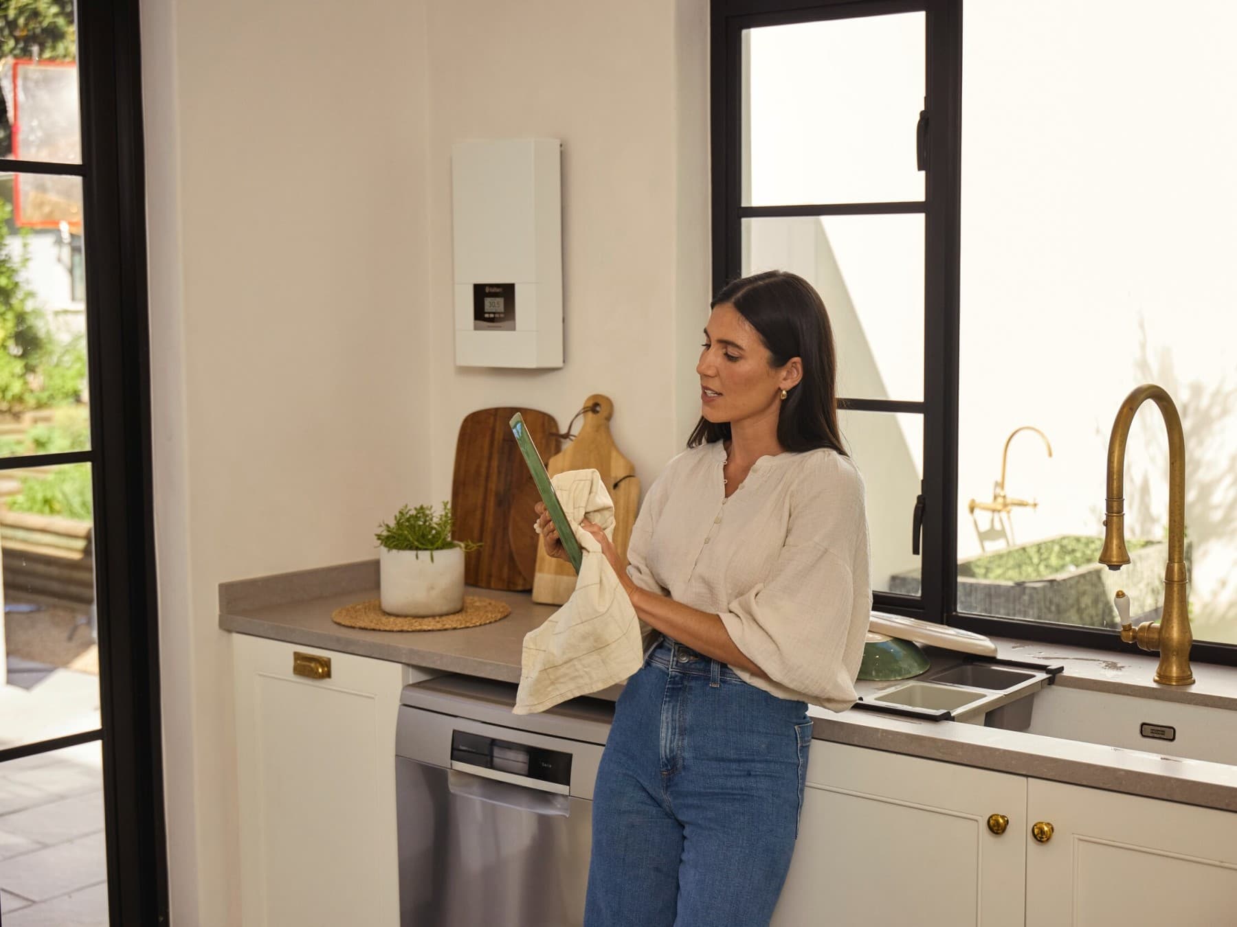 Woman washing dishes in the kitchen
