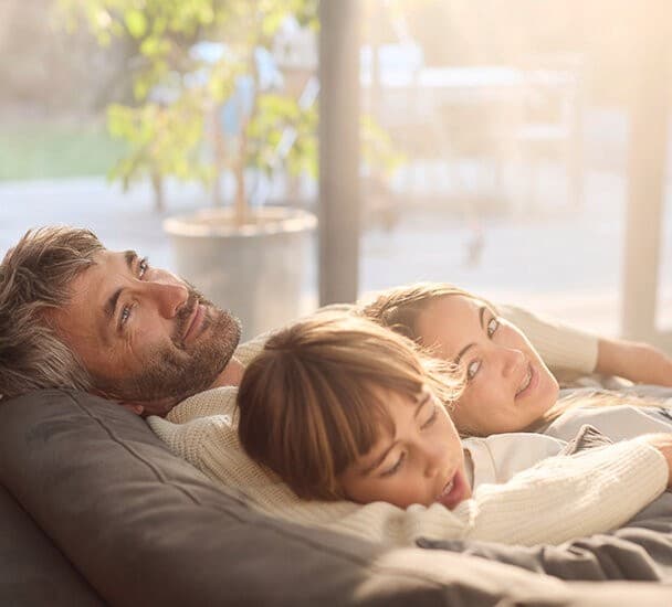Family relaxing on couch