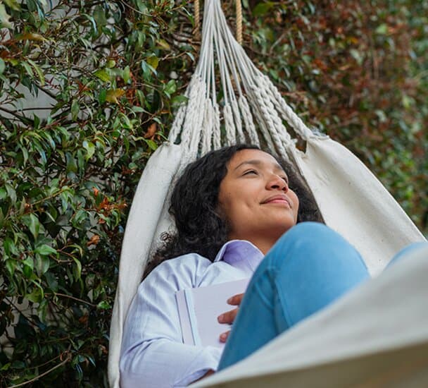 Woman relaxing in a hammock.