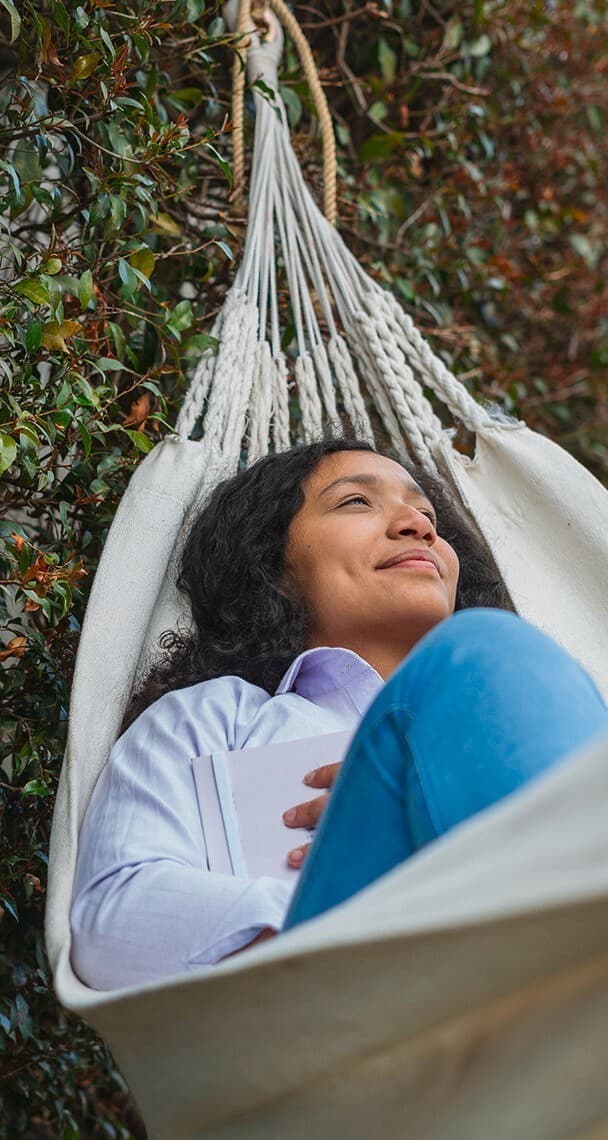 Woman relaxing in hammock