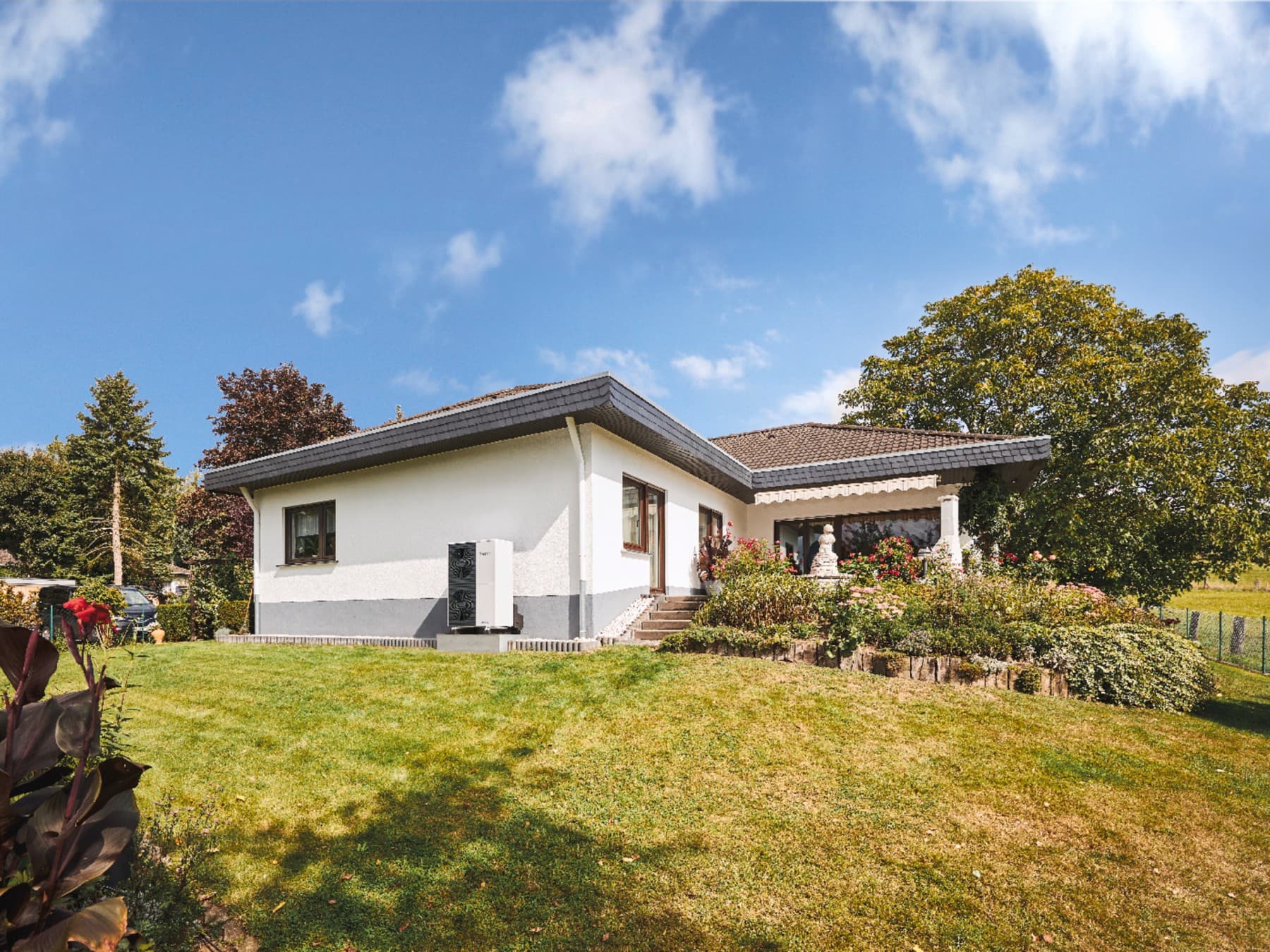 Mid-century modern home with a heat pump.