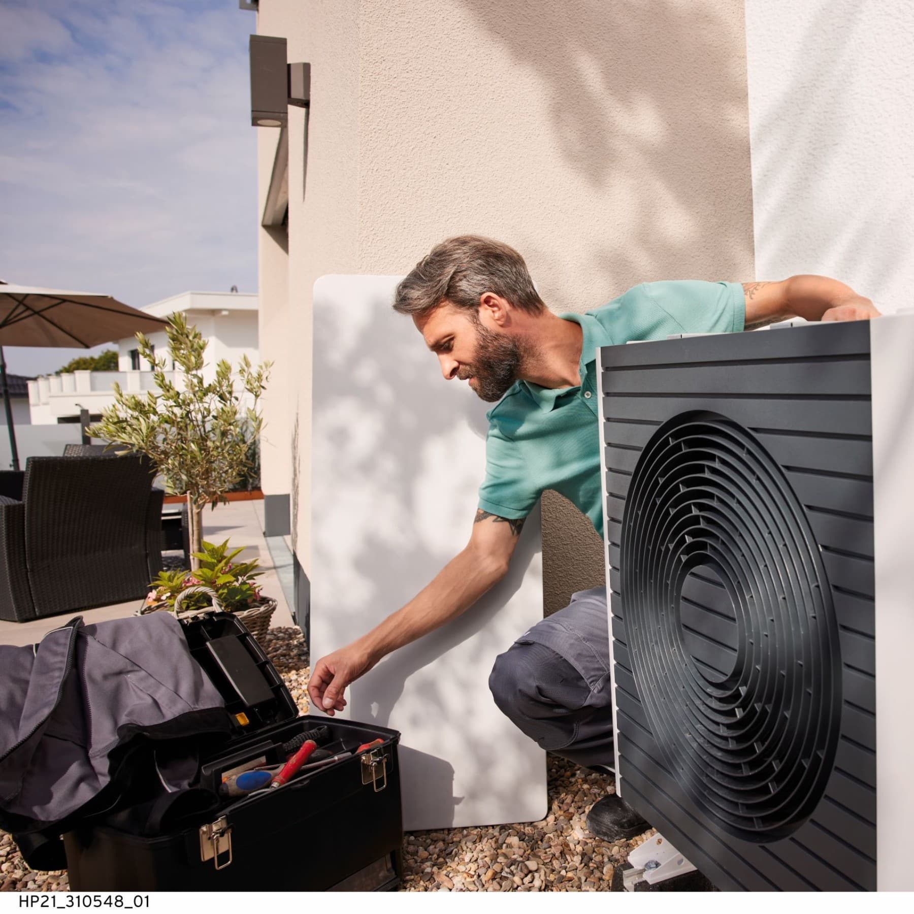 Couple sitting on a heat pump