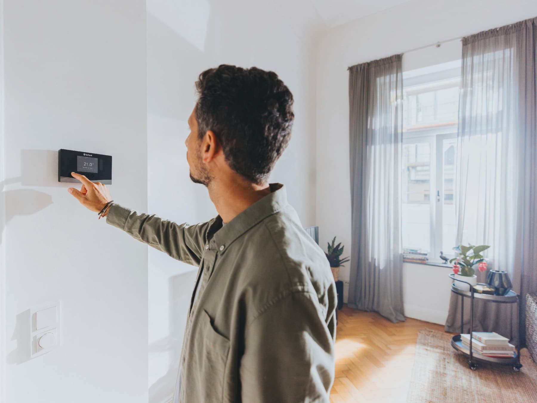 Man checking settings on his control