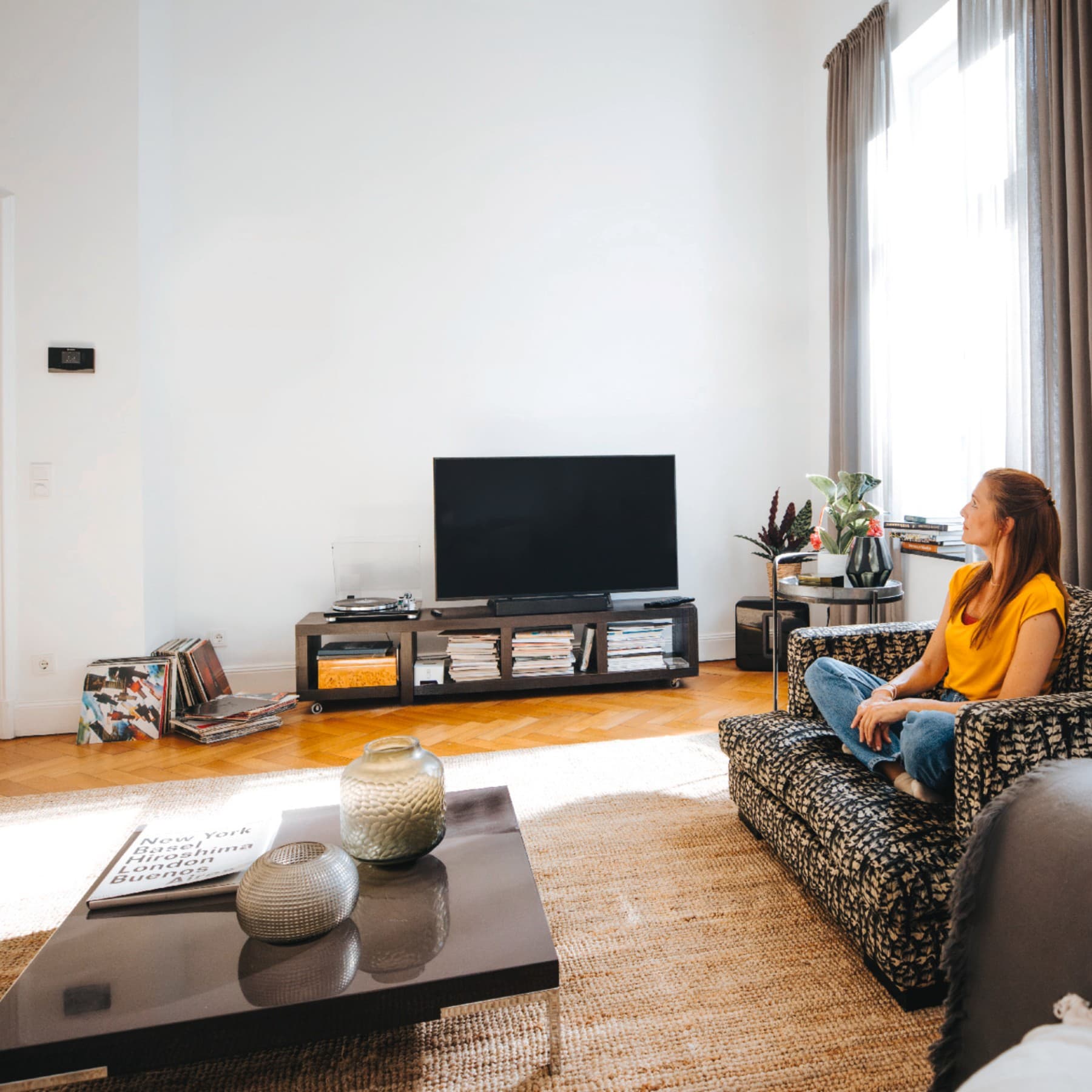 Woman sitting in her living room