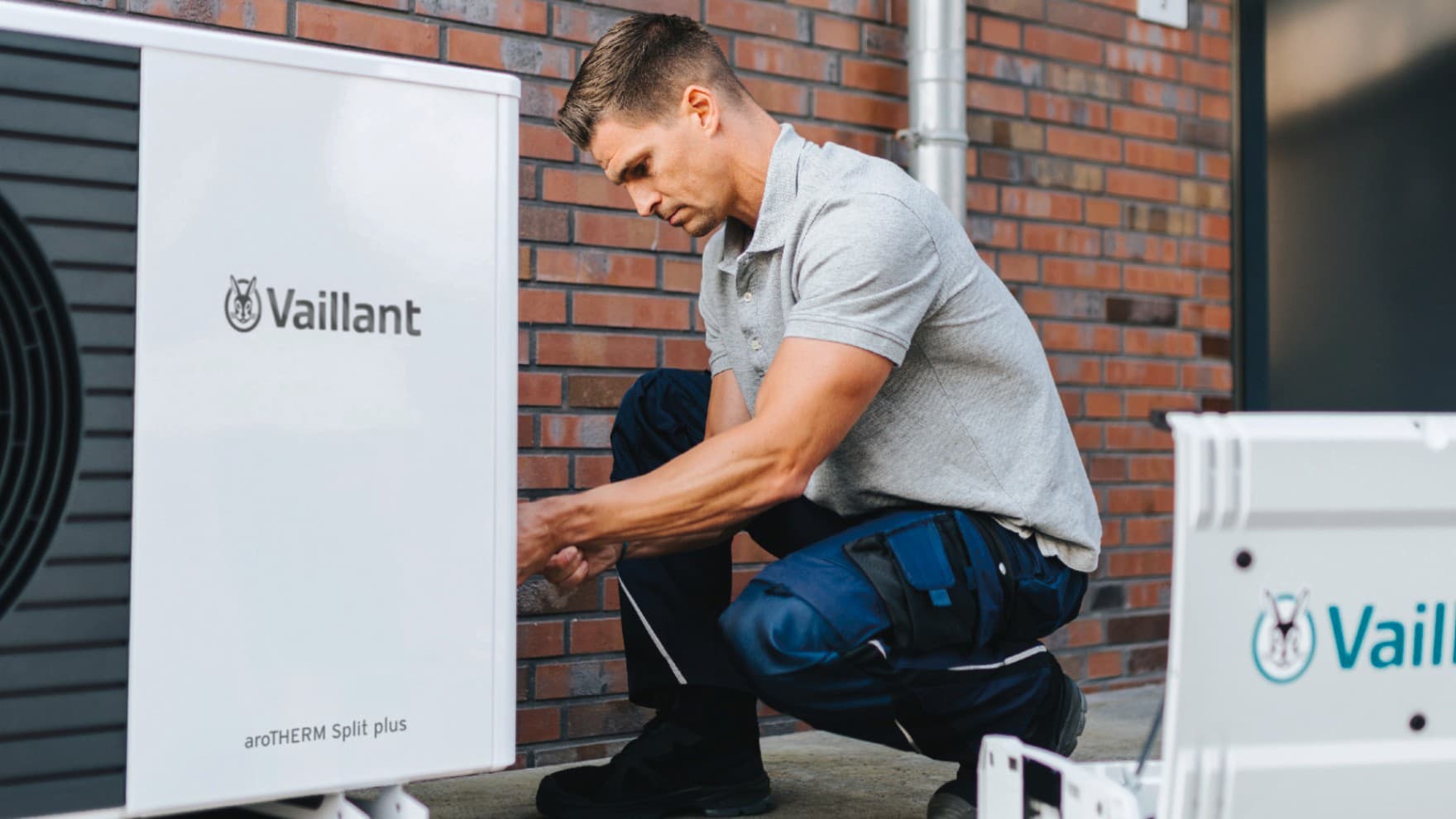 Installer installing a Vaillant heat pump.