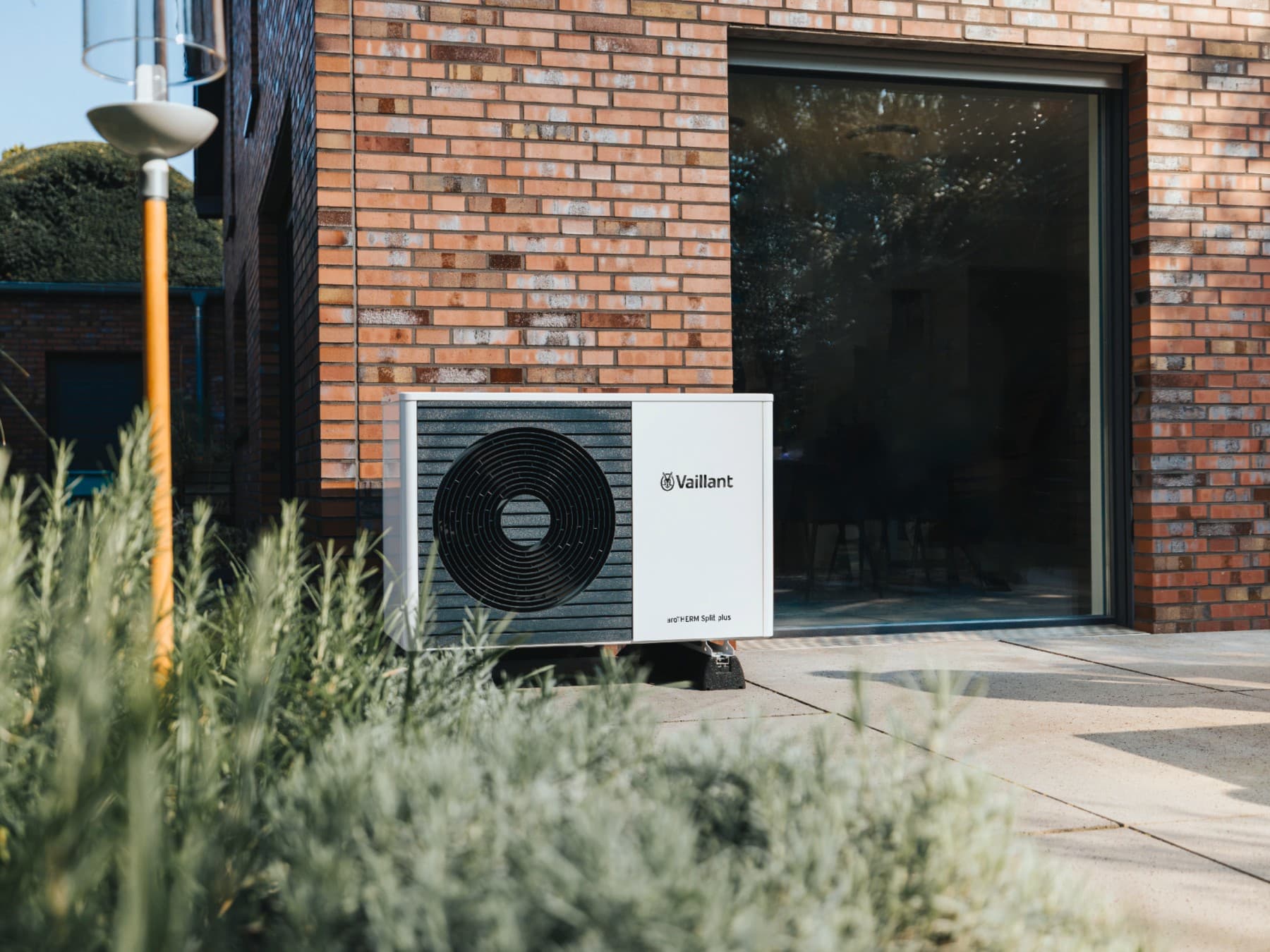 A Vaillant heat pump in front of a modern building