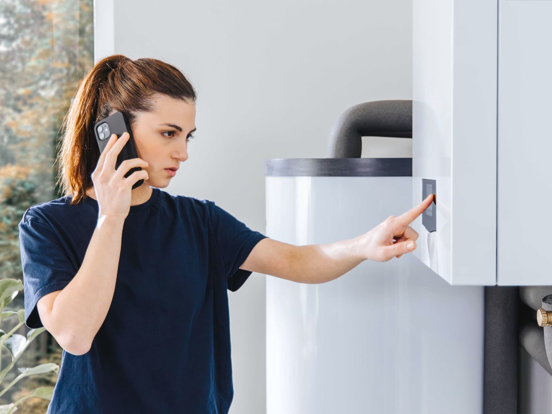 Woman setting her heating