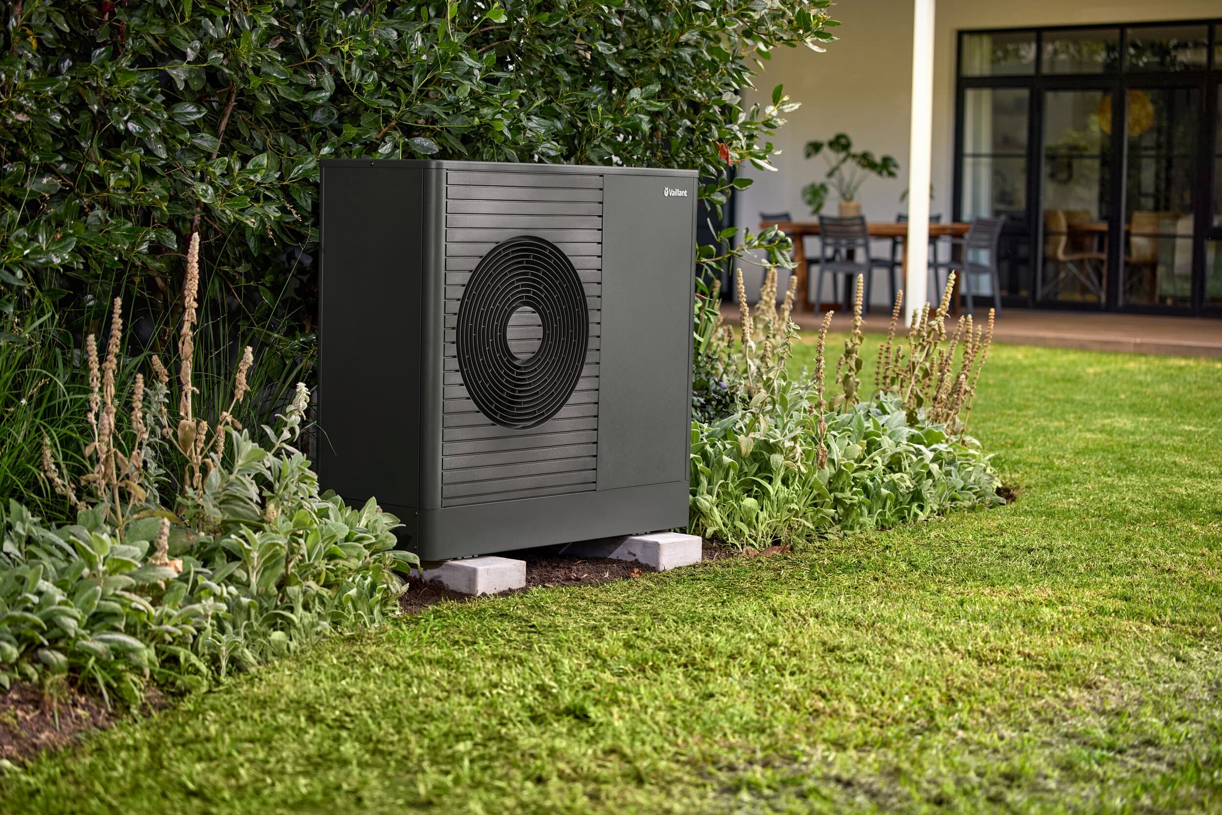 aroTHERM plus standing in a garden