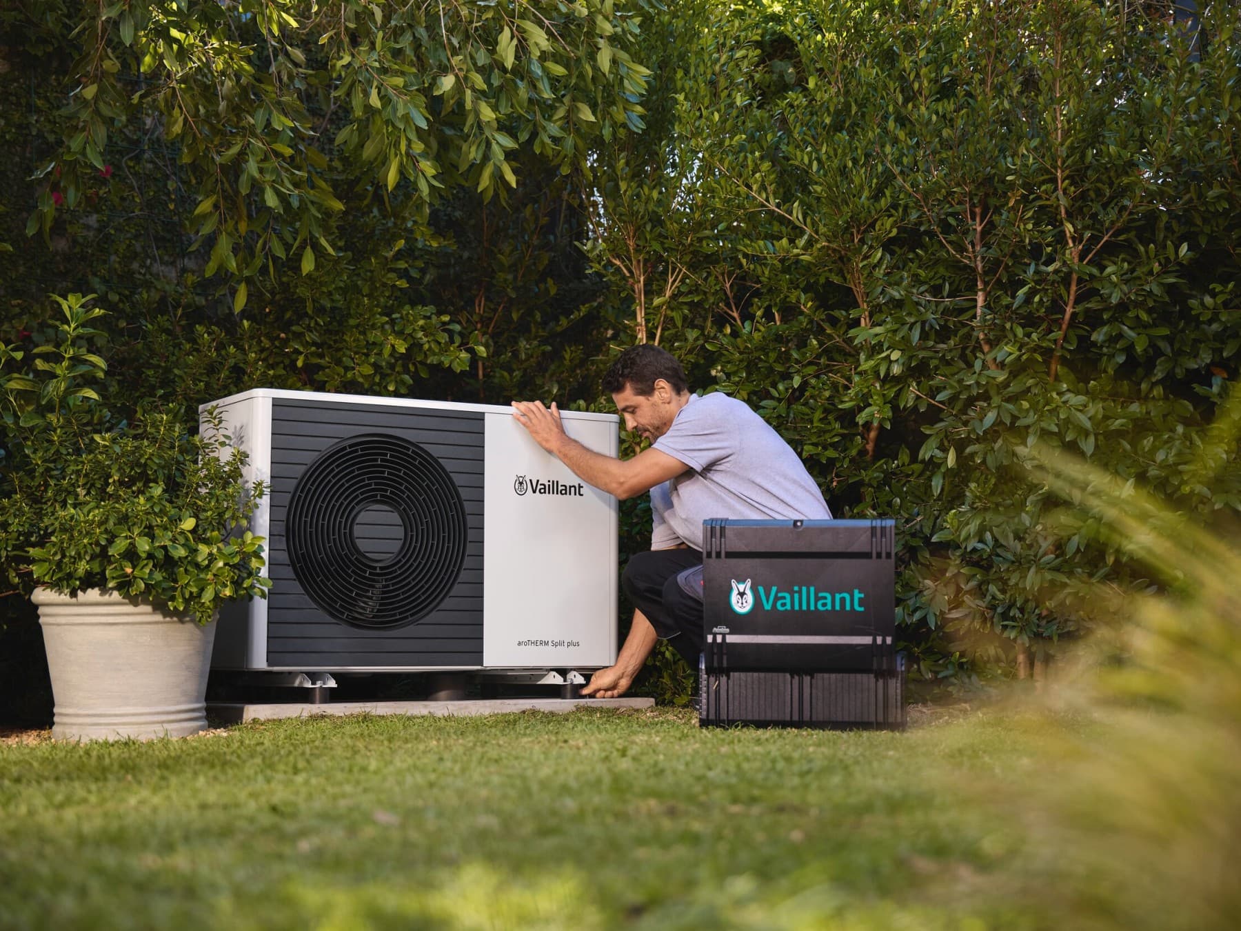 An installer servicing a heat pump