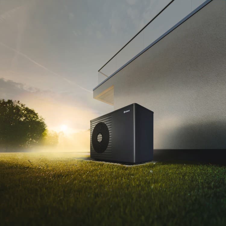 aroTHERM plus heat pump standing in front of a house