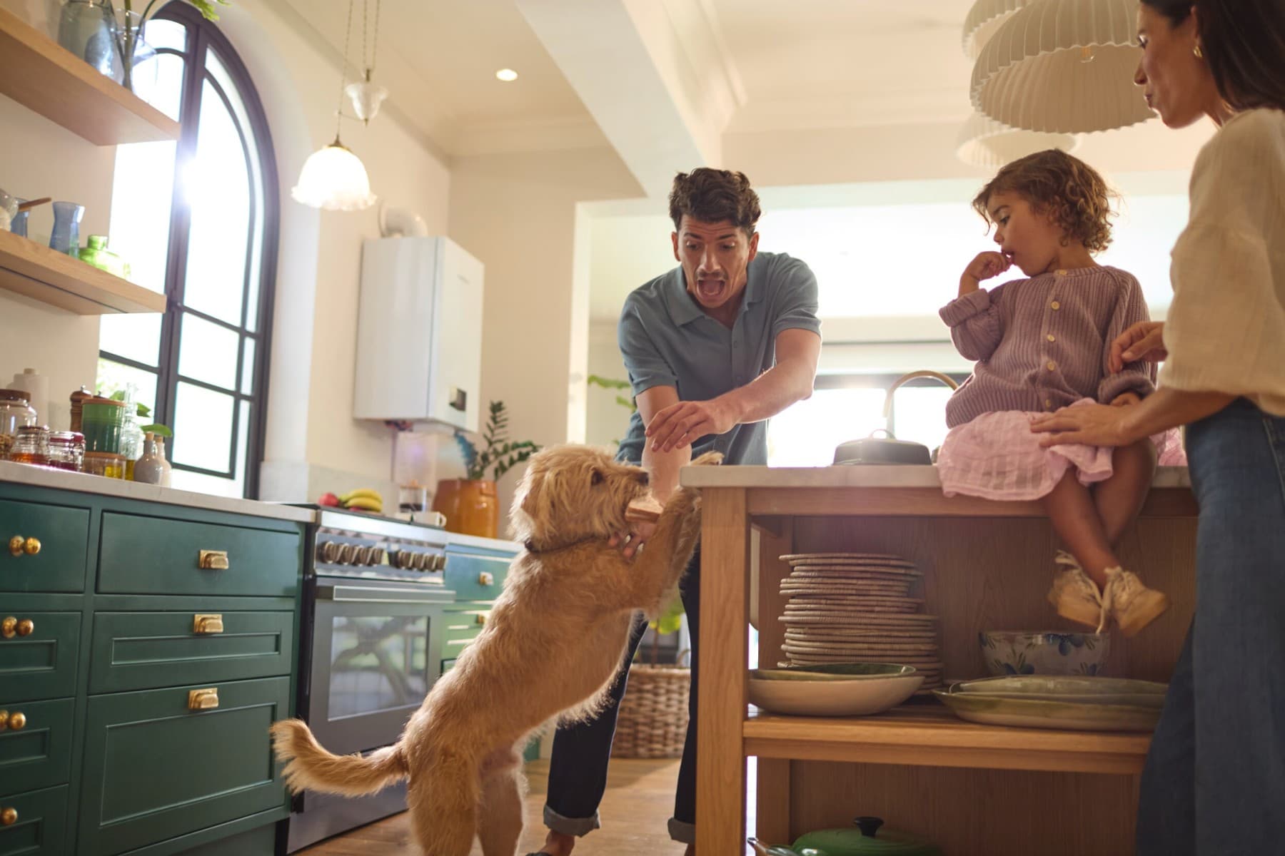 Family with dog in kitchen