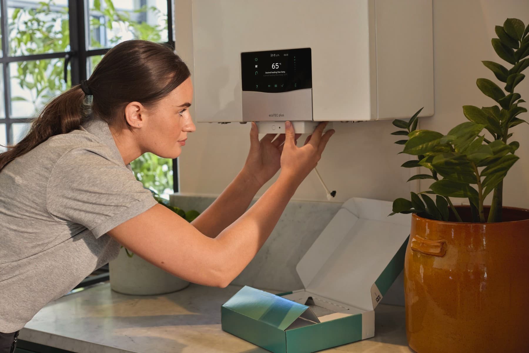 An installer working on a heating device