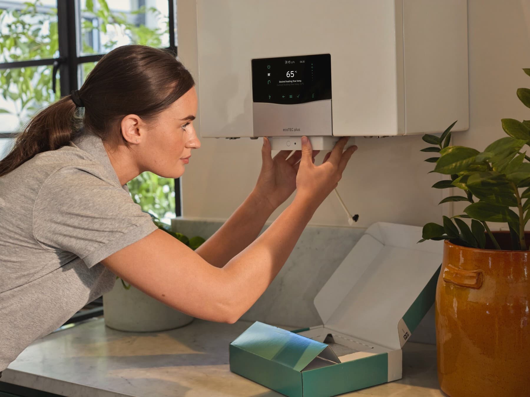 Installer working on a boiler